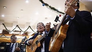 Mexican singers sing a bolero at a cantina in Mexico City on November 4, 2023.