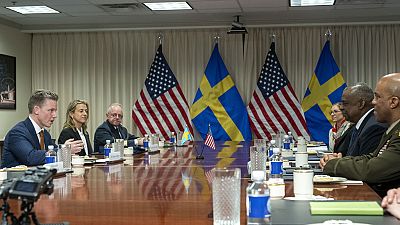 Swedish Defense Minister Pal Jonson, left, speaks during a meeting with Defense Secretary Lloyd Austin, right, at the Pentagon on Tuesday, Dec. 5, 2023, in Washington. 