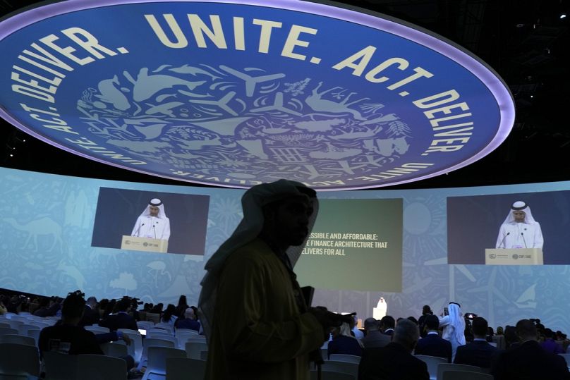 United Arab Emirates Finance Minister Mohamed bin Hadi Al Hussaini speaks at the COP28 U.N. Climate Summit, Monday, Dec. 4, 2023, in Dubai