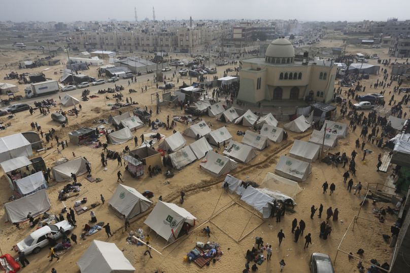 Palestinians displaced by the Israeli bombardment of the Gaza Strip set up a tent camp in Rafah on Wednesday, Dec. 6, 2023