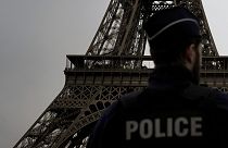 A French policeman patrols near the Eiffel Tower, in Paris earlier in December