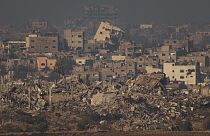 Destroyed buildings from Israeli airstrike are seen in the northern Gaza Strip, as seen from southern Israel, Thursday, Dec. 7, 2023.