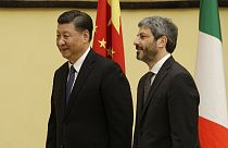 Chinese President Xi Jinping is greeted by chamber speaker Roberto Fico as he visits the Italian lower chamber in Rome Friday, March 22, 2019.
