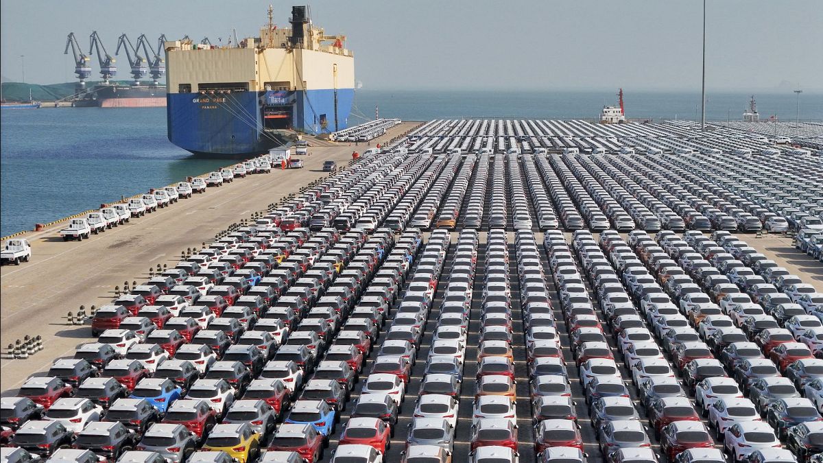 Buick cars are seen before being loaded onto a ship for export at the port in Yantai, in China’s eastern Shandong province on December 7, 2023.