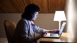 Woman in front of a computer.
