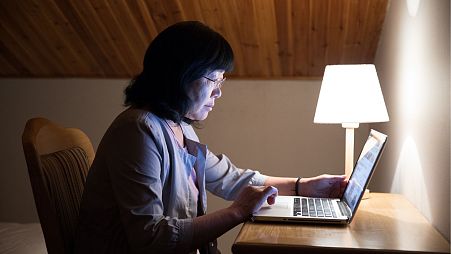 Woman in front of a computer.