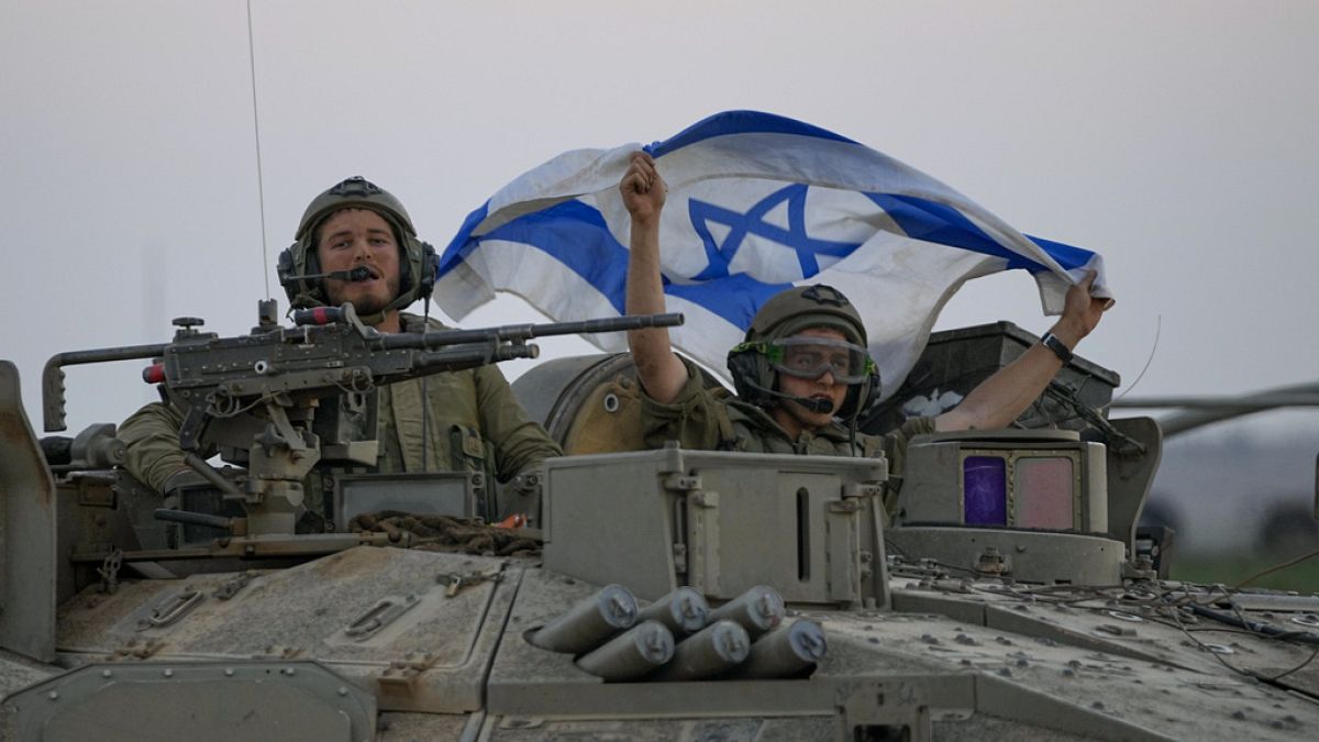 Israeli tanks head towards the Gaza Strip border in southern Israel on Thursday, Oct.12, 2023
