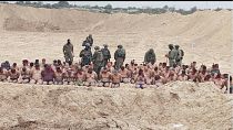 صورة مأخوذة من فيديو نشره الإعلام الإسرائيلي وفيه معتقلون فلسطينيون جبرهم الجيش الإسرائيلي على خلع ملابسهم