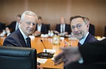 The Minister for Economy and Finance of France, Bruno Le Maire, left, sits next to German Finance Minister, Christian Lindner, right, at the chancellery in Berlin.