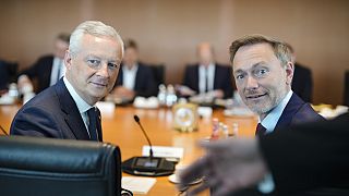 The Minister for Economy and Finance of France, Bruno Le Maire, left, sits next to German Finance Minister, Christian Lindner, right, at the chancellery in Berlin.