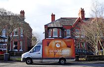 An Ocado delivery van parks outside a residential address near Liverpool in north west England, on February 10, 2019, during a delivery of food and drink for supermarket Waitr