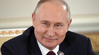 Russian President Vladimir Putin smiles while speaking to the media after the Russia Africa Summit in St. Petersburg, Russia, Saturday, July 29, 2023. 