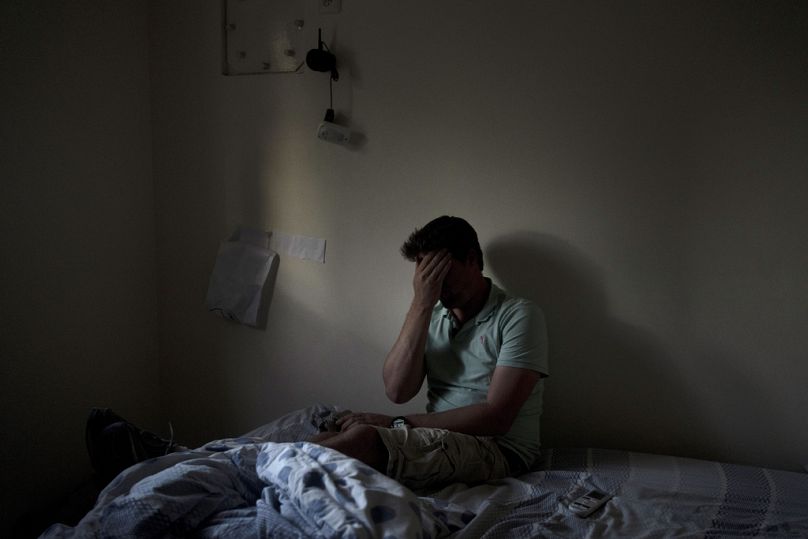 Eyal Barad pauses in the safe room where he sheltered with his family as Hamas rampaged through his community in Kibbutz Nir Oz, 9 November 2023