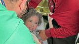 Doctors examine injured Palestinians including children, brought to a hospital after Israeli attacks in Rafah, Gaza