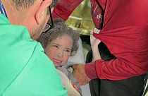 Doctors examine injured Palestinians including children, brought to a hospital after Israeli attacks in Rafah, Gaza