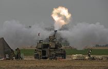 An Israeli mobile artillery unit fires a shell from southern Israel towards the Gaza Strip, in a position near the Israel-Gaza border on Sunday, Dec. 10, 2023.