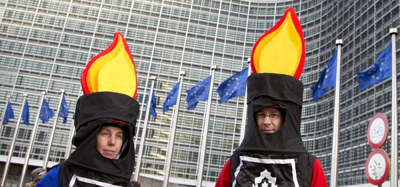 Protestors from an anti-fracking group wait for the start of a demonstration outside EU headquarters in Brussels, January 2014