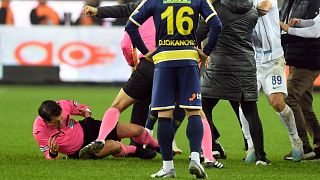 Referee Halil Umut Meler falls down after being punched by MKE Ankaragucu president Faruk Koca