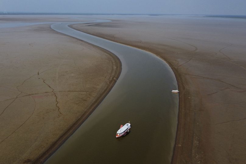A ferry boat travels through a section of the Amazon River affected by a severe drought, near Manacapuru, Brazil in September.