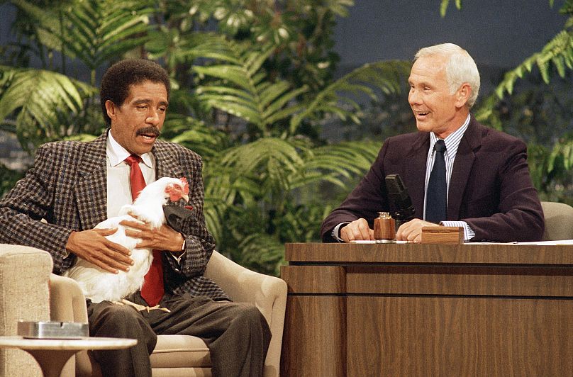 Richard Pryor holds a chicken while speaking with Johnny Carson on "The Tonight Show" at the NBC studio in Burbank, Calif., Oct. 9, 1986