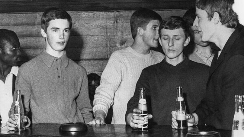 Youths drink at the bar, The Caxton, Westminster, London, UK, 1967