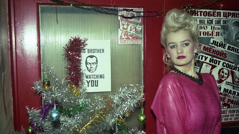 Ruth posing next to christmas tree, London, UK, December 1985