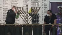 Workers in the Polish parliament clean up a menorah  Warsaw, Poland, on Tuesday Dec. 12, 2023. 