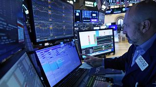 Specialist works at his post on the floor of the New York Stock Exchange