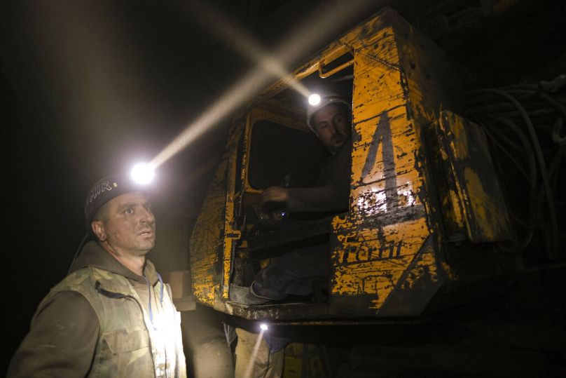 Bosnian coal miners work in an underground tunnel at a mine in Zenica, April 2021