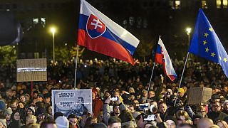 People take part in a protest against scrapping the Special Prosecutor's Office organised by the Slovakian opposition parties in front of the Government Office in Bratislava