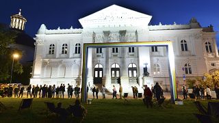 People queue to visit the Zachęta National Gallery of Art for the 2021 Night of Museums in Warsaw, Poland.