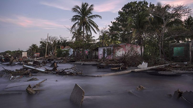Debris from collapsed home and felled trees litter the shore line of the coastal community of El Bosque, in the state of Tabasco, Mexico, Thursday, Nov. 30, 2023.