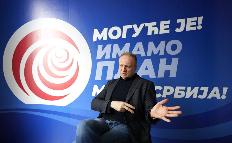 FILE: Dragan Djilas, leader of the Freedom and Justice coalition gestures during an interview with the Associated Press, in Belgrade, Serbia, Wednesday, March 30, 2022.
