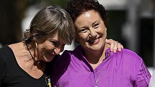 Kathleen Folbigg, right, is embraced by friend Tracy Chapman outside the New South Wales Court of Criminal Appeal in Sydney, Australia