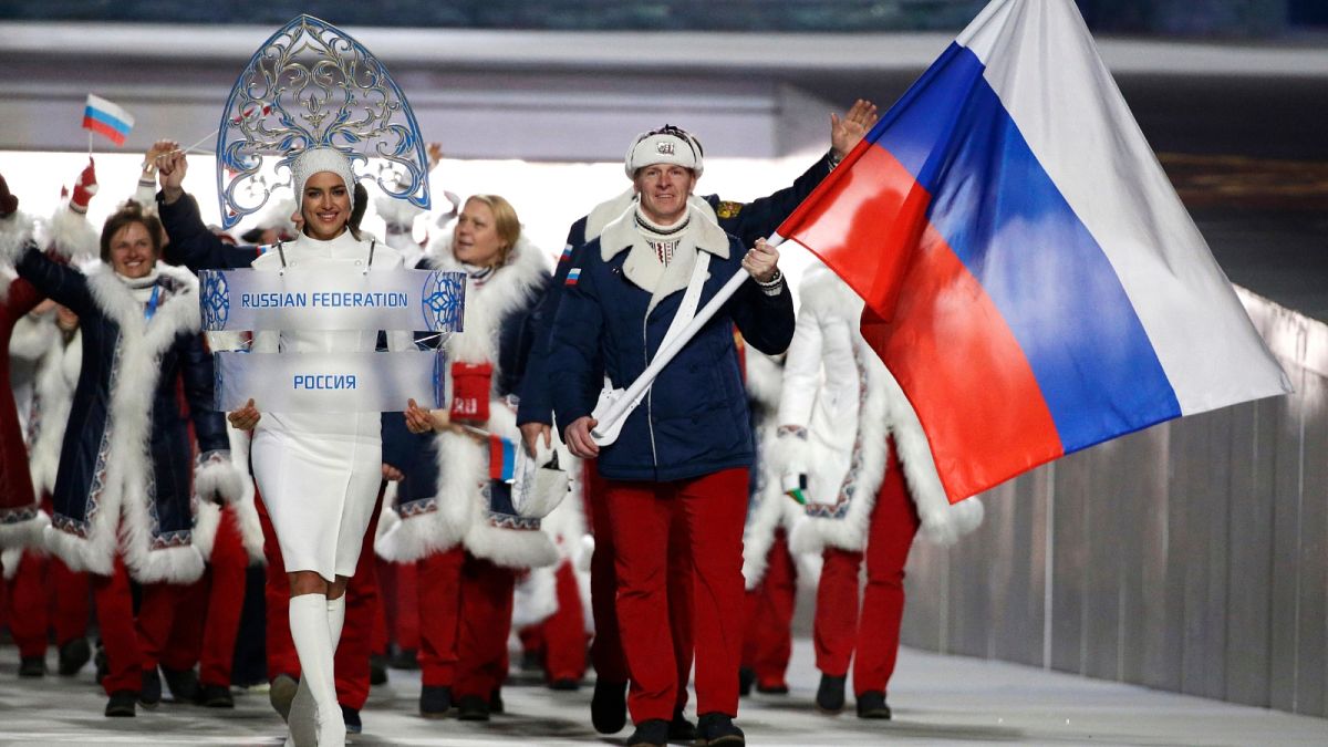 FILE: FILE - Bobsledder Alexander Zubkov carries the Russian flag during the opening ceremony of the 2014 Winter Olympics in Sochi, Russia, on Feb. 7, 2014.