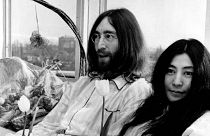 John Lennon and his wife, Yoko Ono, hold a bed-in for peace in room 902, the presidential suite at the Hilton Hotel in Amsterdam on March 25, 1969