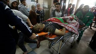 Palestinians wounded in the Israeli bombardment of the Gaza Strip arrive to Nasser hospital in Khan Younis, Thursday, Dec. 14, 2023.