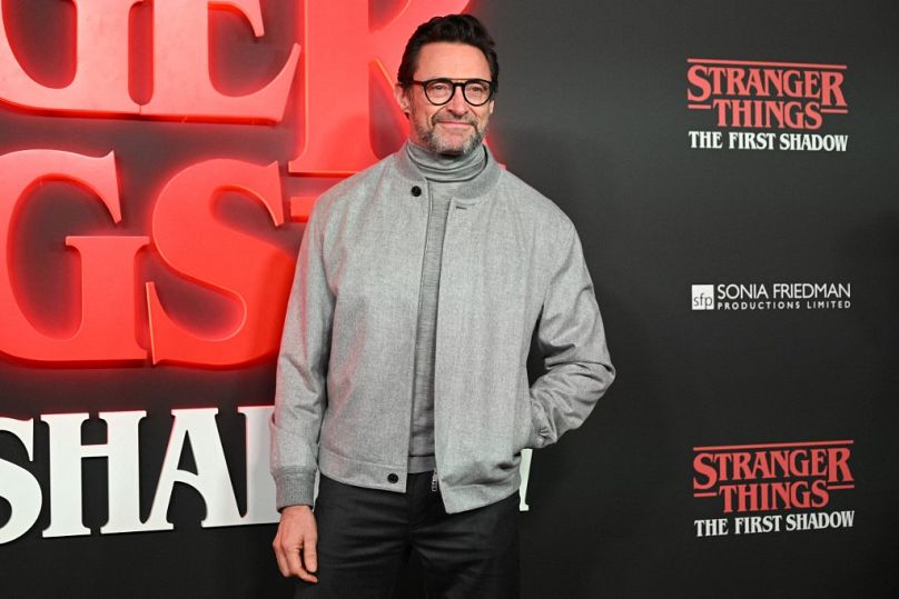 Australian actor Hugh Jackman poses on the red carpet upon arrival to attend the West End world premiere of "Stranger Things: The Last Shadow"