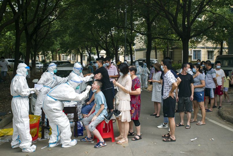 Residents line up to be tested for COVID-19 in Wuhan, August 2021