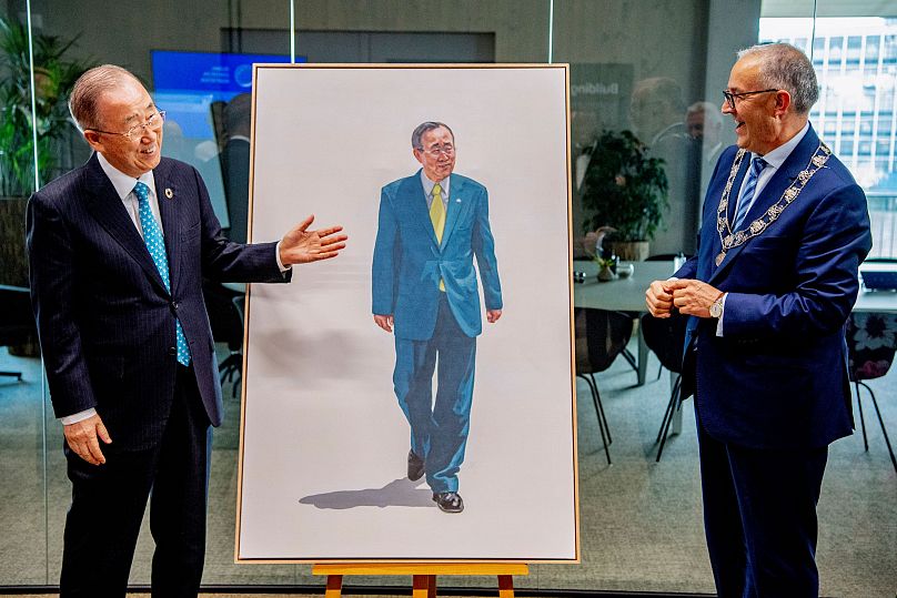Mayor Ahmed Aboutaleb (right) unveils an artwork of former UN Secretary-General Ban Ki-moon during a high-level dialogue on climate adaptation in Rotterdam, September 2021.