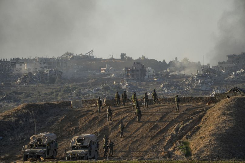 Israeli troops are seen near the Gaza Strip border, December 2023