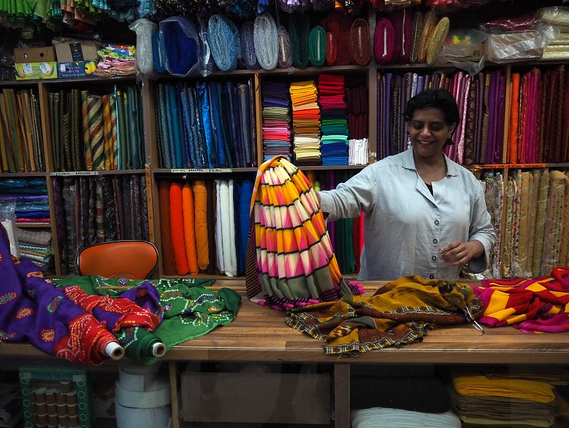 Bina talks us through a variety of beautiful saris at her family shop, B.L. Joshi on Ealing Road.