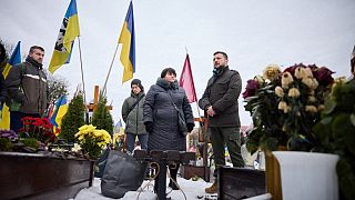 Ukrainian President Volodymyr Zelensky visiting the graves of Ukrainian soldiers at the Lychakiv Cemetery in Lviv, 15 December 2023