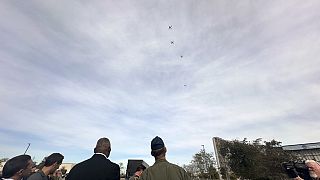 Defense Secretary Lloyd Austin watches as a swarm of five drones takes off from a parking area at the Defense Innovation Unit in Mountain View, Calif, on Friday, Dec. 1, 2023.