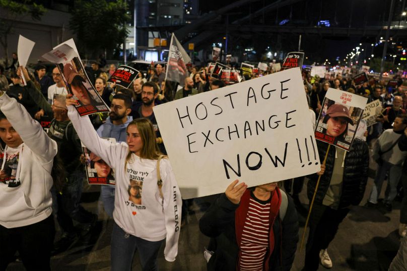 Families and supporters of hostages hostages held by Hamas demonstrate in Tel Aviv calling for an immediate hostage exchange deal