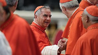 Cardinal Angelo Becciu attends a consistory inside St. Peter's Basilica, at the Vatican in August