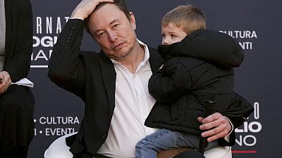 Tesla's CEO Elon Musk, holding his son, attends the annual political festival Atreju, organised by the Brothers of Italy political party, in Rome, December 16th 2023