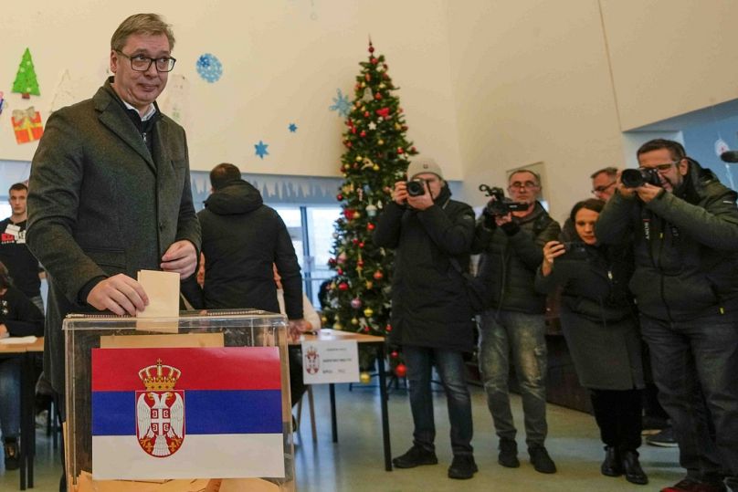 Serbian President Aleksandar Vucic casts his ballot for a parliamentary and local election at a polling station in Belgrade, Serbia, Sunday, Dec. 17, 2023.