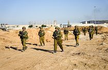 Israeli soldiers are seen during a ground operation in the northern Gaza Strip, amid a report of HRW reporting starvation being used as a tactic against Palestinians