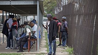 South Africa: Families anxiously wait outside underground mine protest
